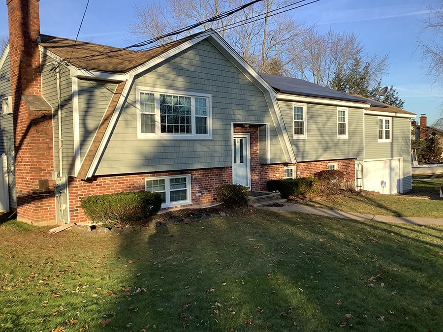 green vinyl siding installed on a home in Connecticut